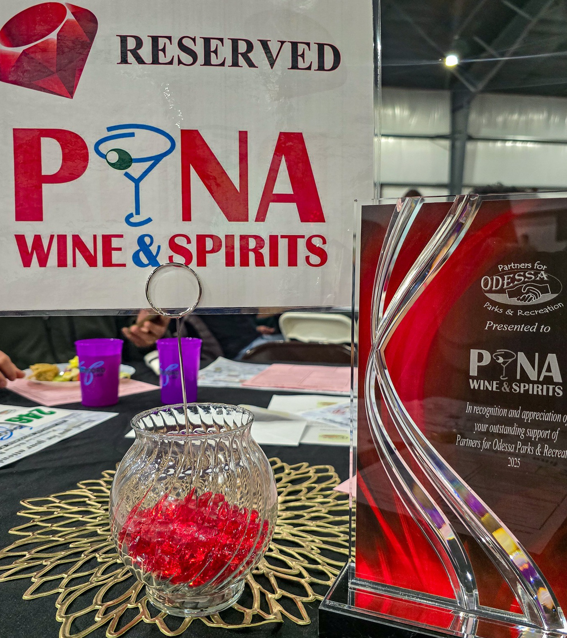 Pina Wine & Spirits reserved sign and community recognition award